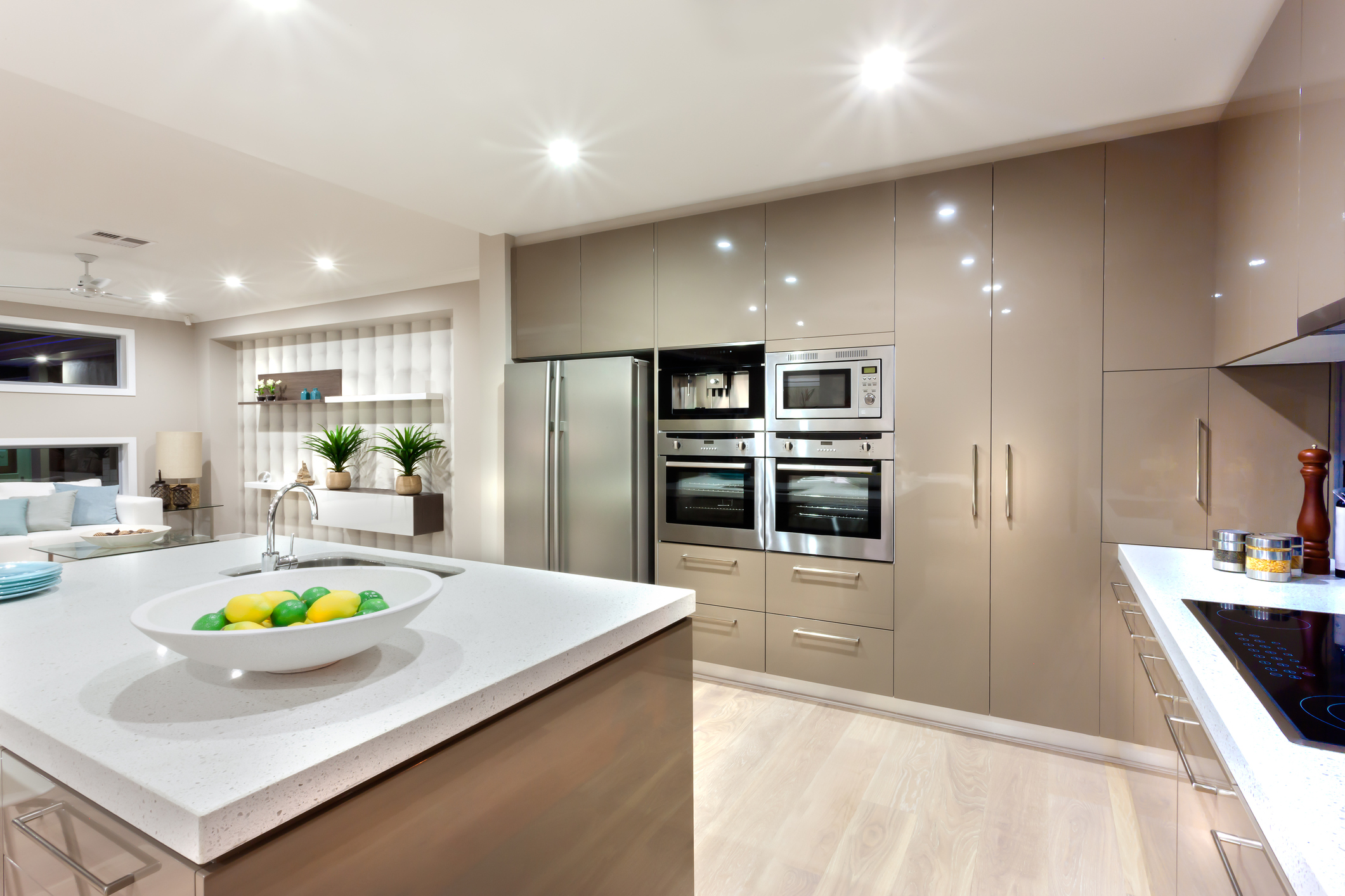 Bright, energy-efficient kitchen with recessed ceiling lights and sleek cabinetry, highlighting smart lighting integration.